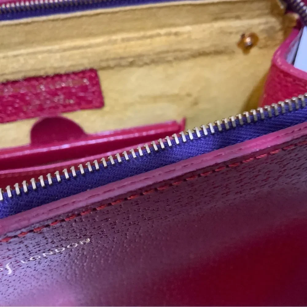 NWOT Aspinal of London red reptile cosmetic case.
